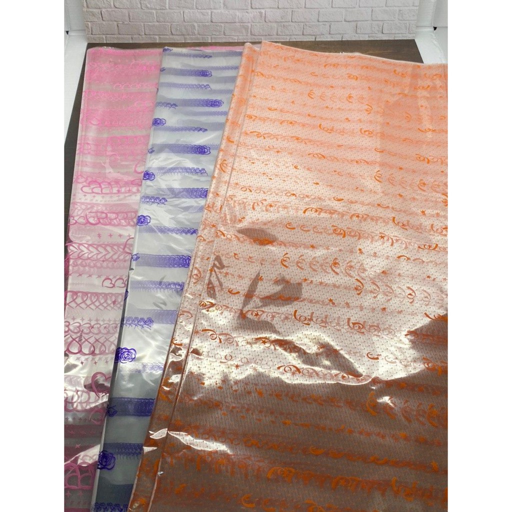 

PLASTIK PARSEL MOTIF / PLASTIK KADO MOTIF / KERTAS KADO TRANSPARANT MOTIF ISI 25 LEMBAR