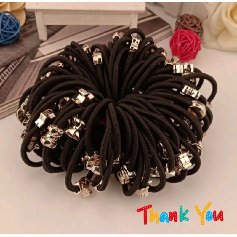 ikat rambut hitam motif