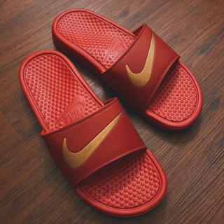 red gold nike slides