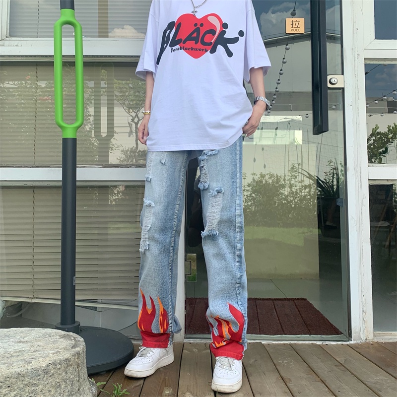 Celana jeans jeans sobek hiphop Amerika trendi jalanan all-match celana jeans cetak api