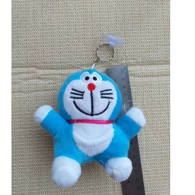 Boneka SNI doraemon tempel kaca mobil