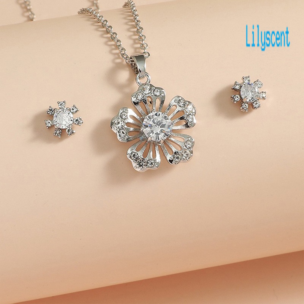1 Set Kalung Dan Anting Bentuk Kepingan Salju Model Hollow Out Bahan Cubic Zirconia Untuk Wanita