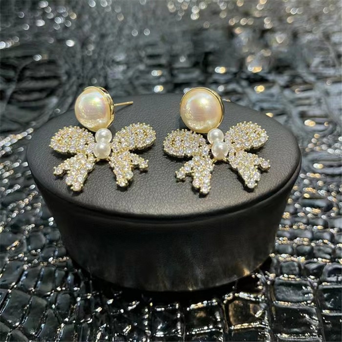 Anting Tusuk Gantung Desain Pita Hollow Hias Mutiaraberlian Gaya Jepangkorea Untuk Wanita