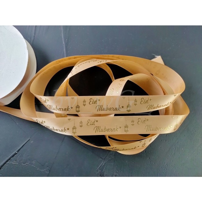 

Pita Idul Fitri -Satin Emboss Emas ;Lebar 2.5 cm ; Cream