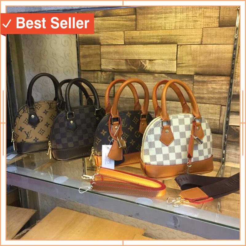 TAS WANITA TRAVELLING MURAH CANTIK UNIK ORI / LV ALMA MINI (2 tali+gembok) uk18x14