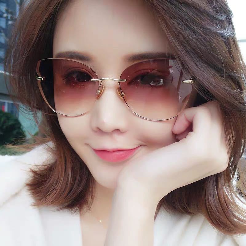 Kacamata Hitam Model Mata Kucing Rimless Perlindungan UV400 Untuk Wanita