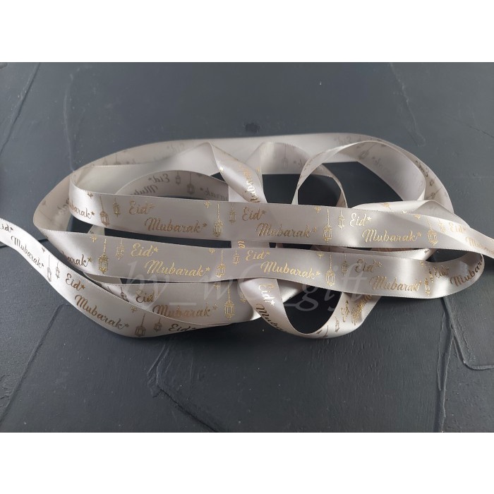 

Pita Idul Fitri -Satin Emboss Emas ;Lebar 2.5 cm ; Abu-abu