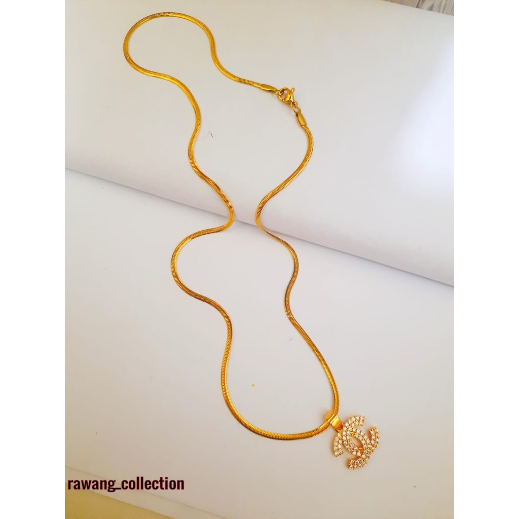 kalung titanium gold plus liontin anti karat selamanya