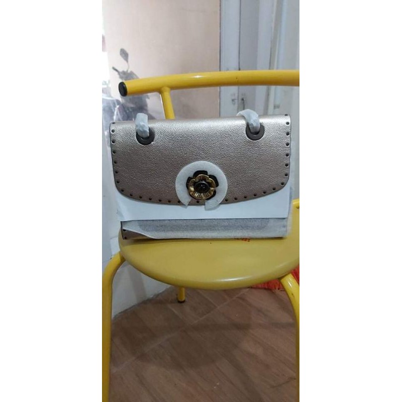 

SOLD coach parker rivet signature metallic original