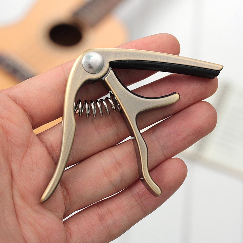 Capo Ukulele Bahan Zinc Alloy 3 Warna Dengan Bantalan Silikon