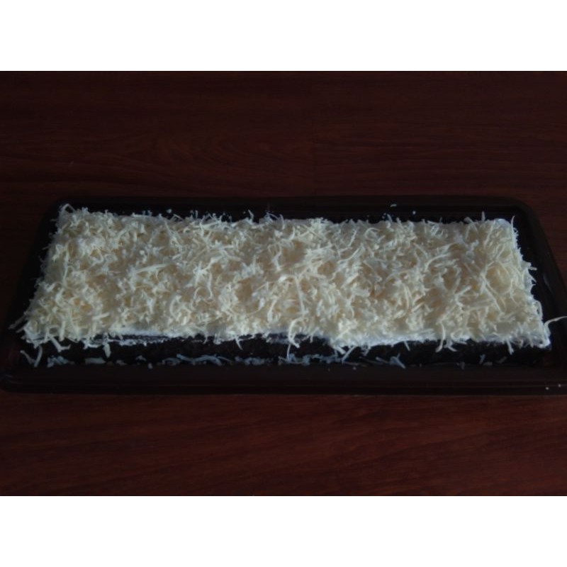 

bolu etan hitam topping