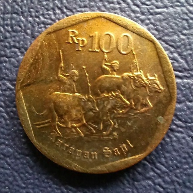 Uang koin kuno 100 karapan sapi
