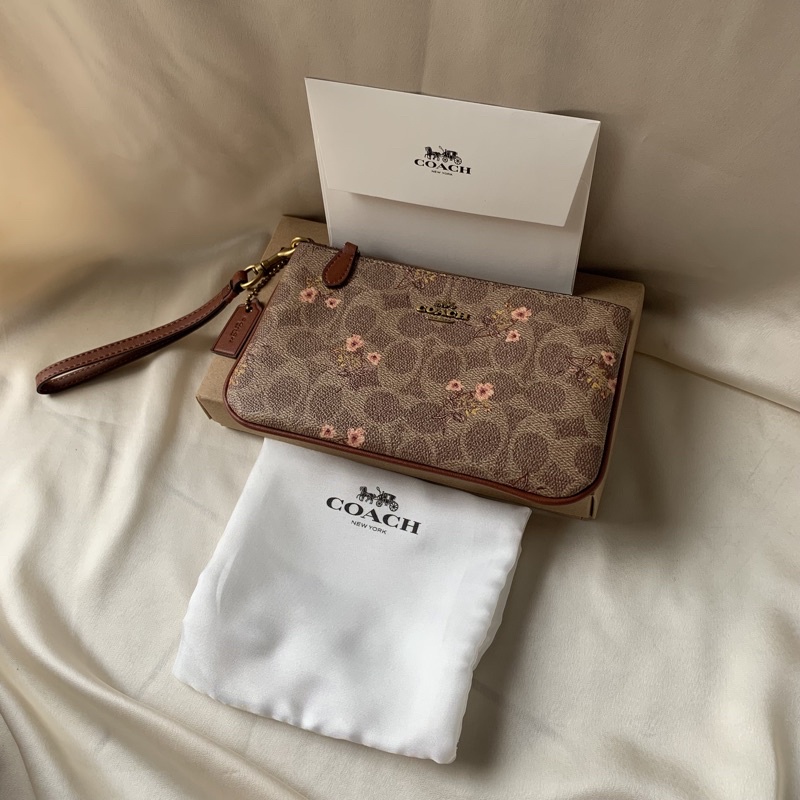 Coach Small Wristlet In Signature Canvas With Floral Bow Print (F67070)