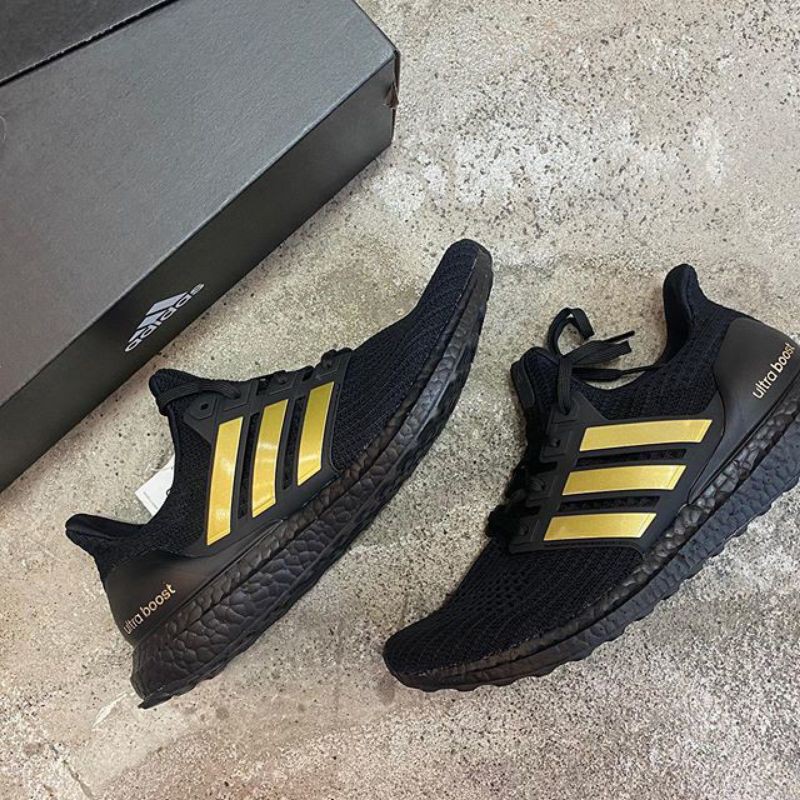 black and gold adidas