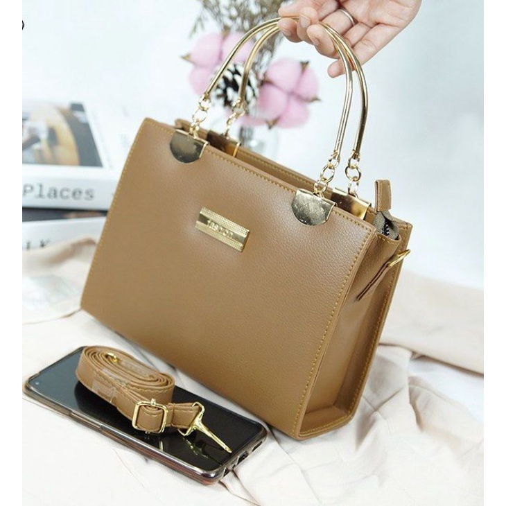 Tas kulit gagang besi