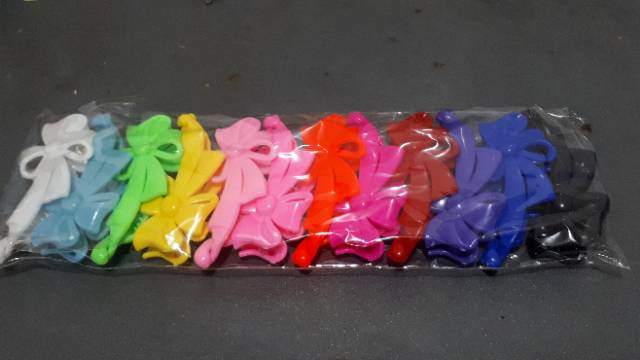 Jepit rambut pisang motif pita perlusin