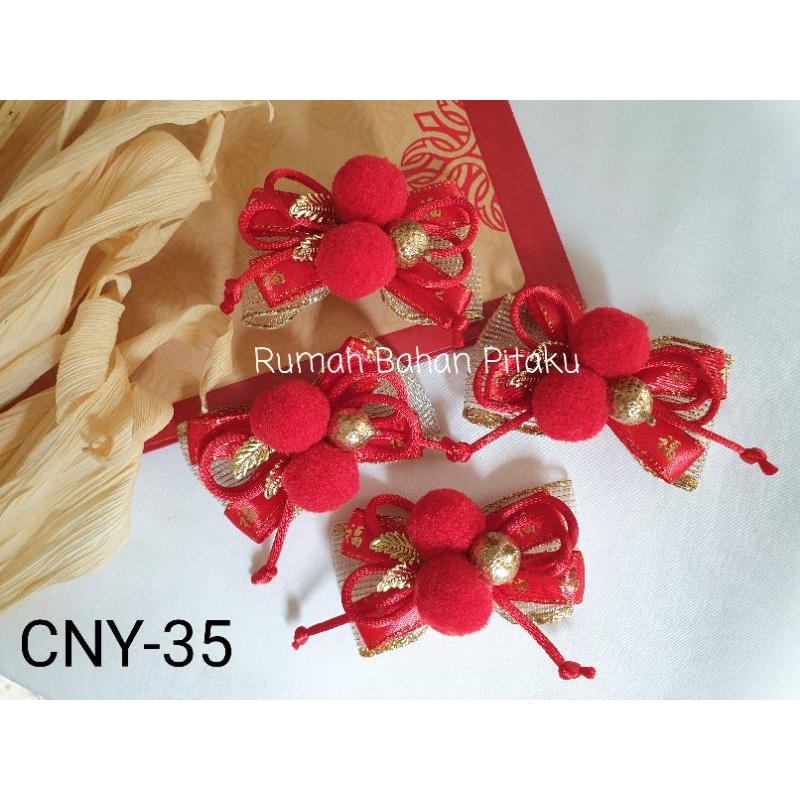 

(CNY-35) APLIKASI PITA IMLEK/CNY/GONG XI FAT CAI UNTUK HAMPERS/JEPIT RAMBUT,HARGA per-BIJI