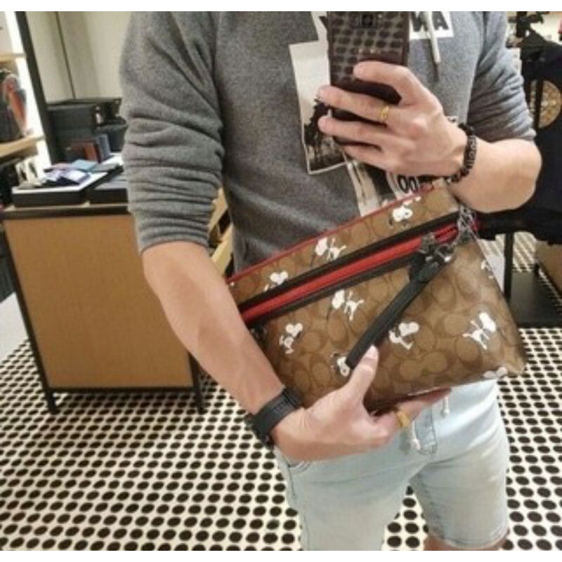Coach X Peanuts Carryall Pouch In Signature Canvas With Snoopy Print (5734)