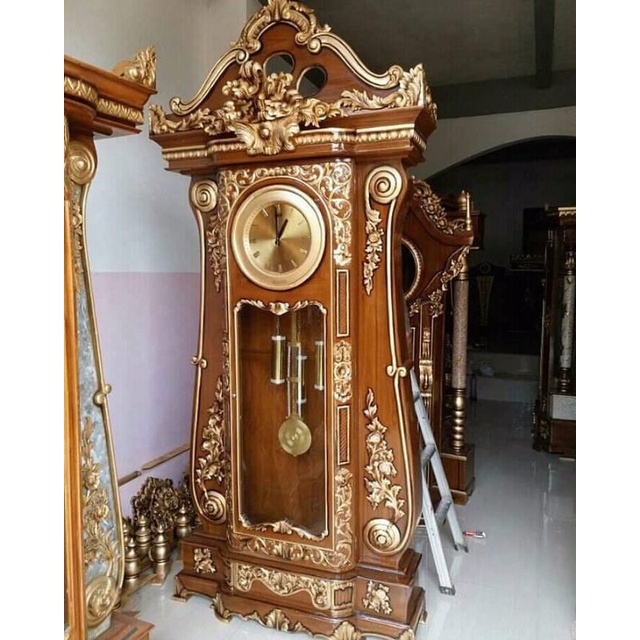 lemari hias jam jati jepara ukir bagong/lemari hias jati jam bagong