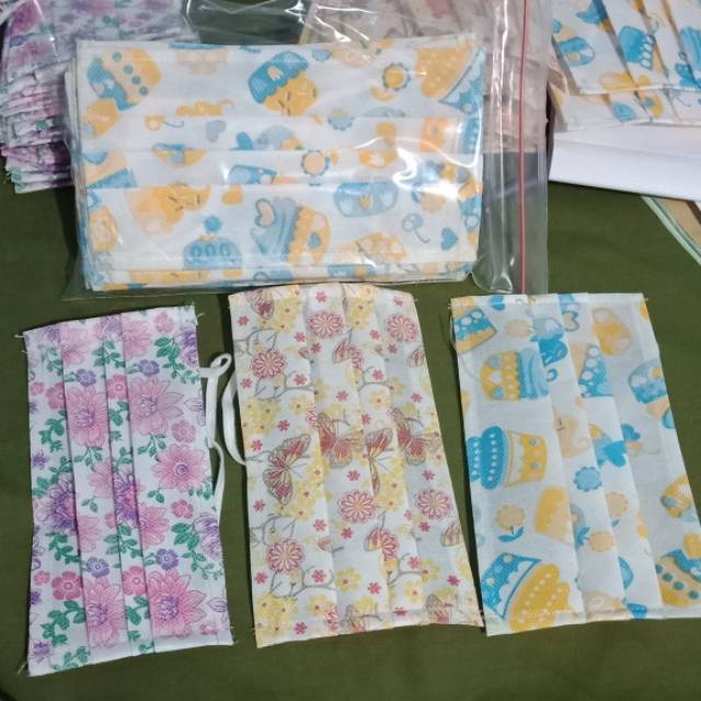 Masker Kain Spunbond Motif 1 lusin