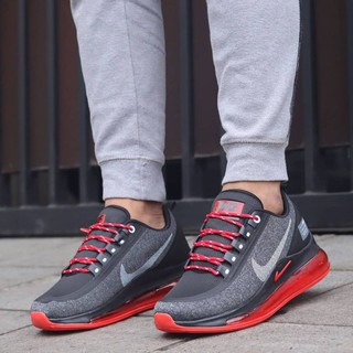 gray and red nike shoes