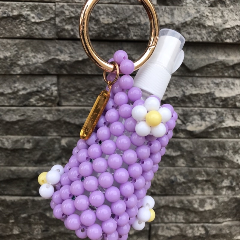 Hand sanitizer holder with daisy