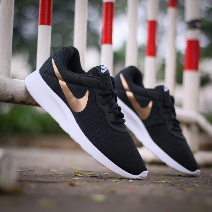 nike tanjun niño negras