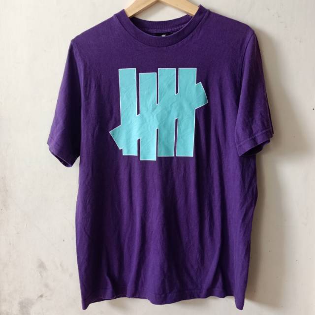 TSHIRT UNDEFEAT PURPLE ORIGINAL / KAOS UNDEFEATED ORIGINAL