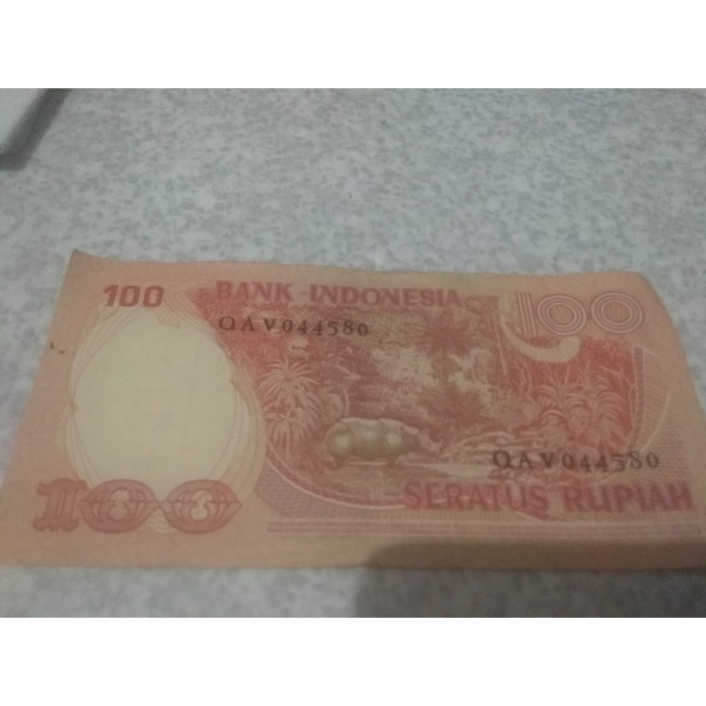 Uang Kuno Tahun 1957 Rp.100 seri Badak Cula Satu