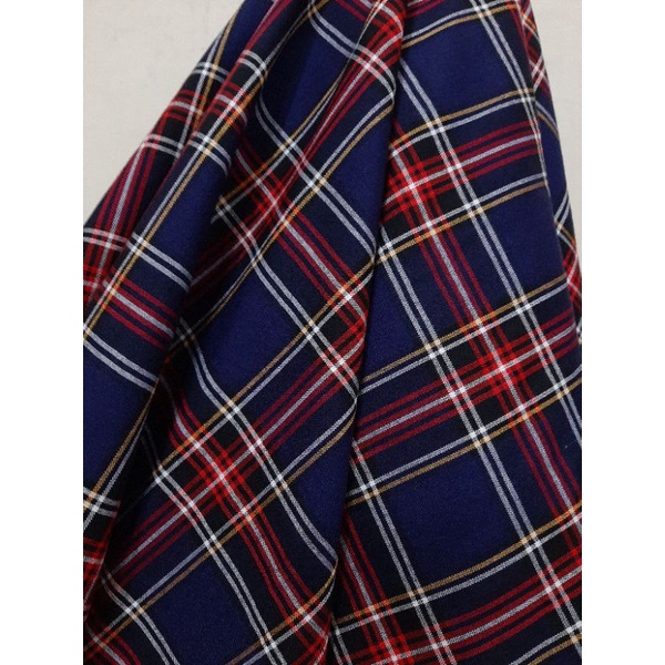 Kain Kotak Yarndyed (dasar biru navy garis merah putih kuning), harga per 25 cm = 11.000, min pesana