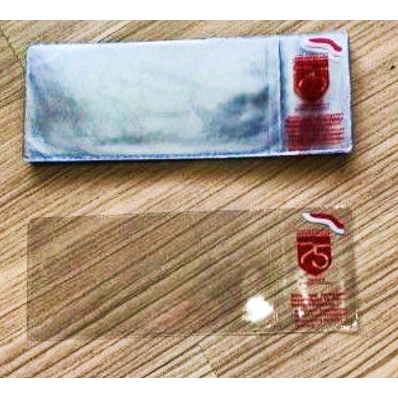 plastik pelindung uang 75rupiah