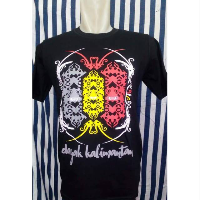 Baju Kaos Distro Cowok Motif Tameng Dayak Kalimantan Baju Kaos Distro Cowok Motif Tameng Dayak Kalimantan