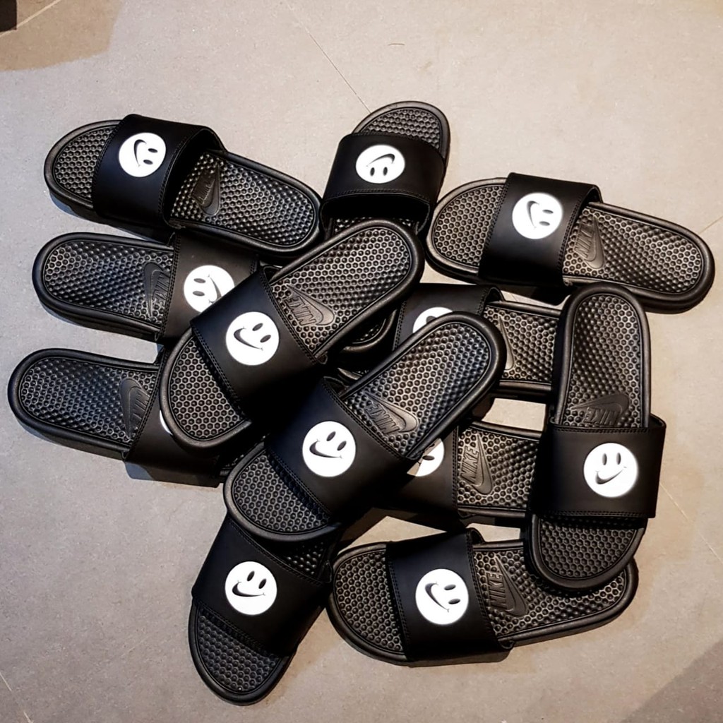 nike smiley face slides