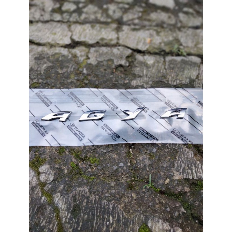 EMBLEM AGYA KAP MESIN