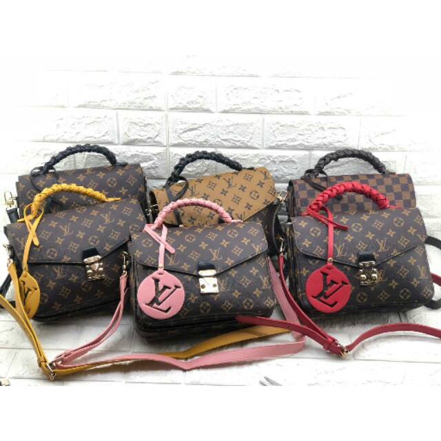 Tas slempang LV metis kepang