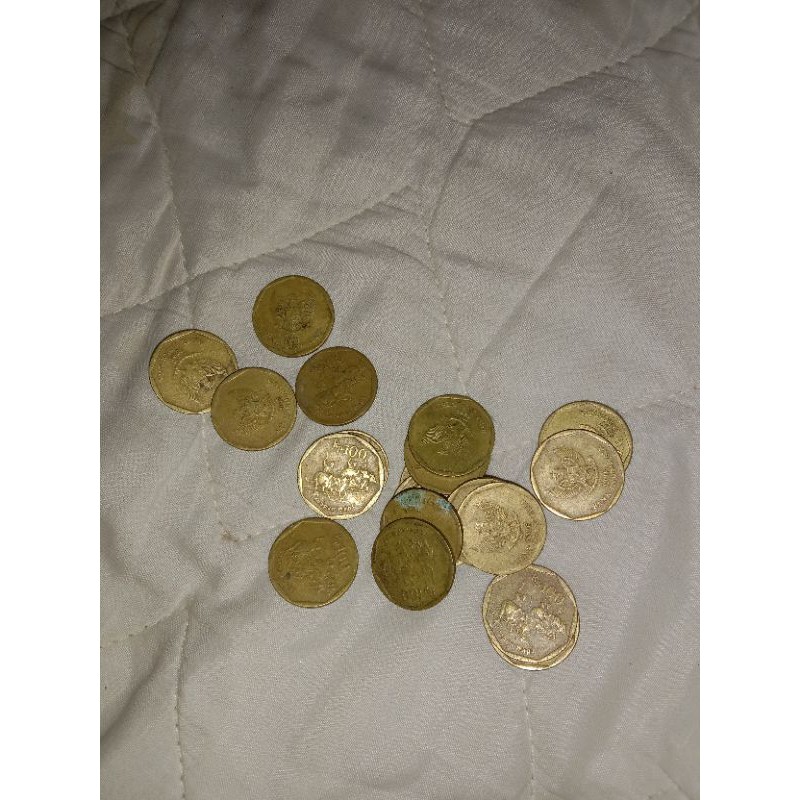uang koin 100 rupiah karapan sapi