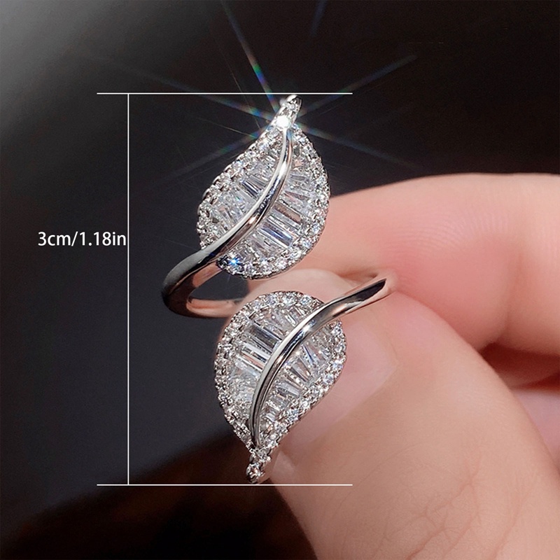 Cincin Model Terbuka Adjustable Desain Daun Aksen Kristal Kubik Zirkonia Warna Silver Untuk Wanita