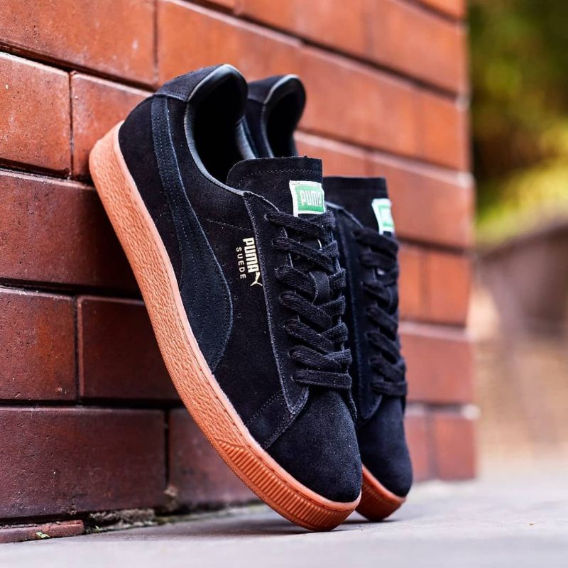 black suede pumas with brown sole