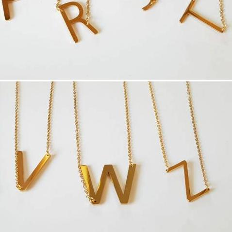 KALUNG HURUF KECIL GOLD kalung inisial titanium antikarat import