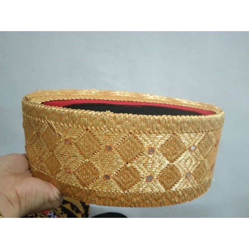 peci tapis mata kibau