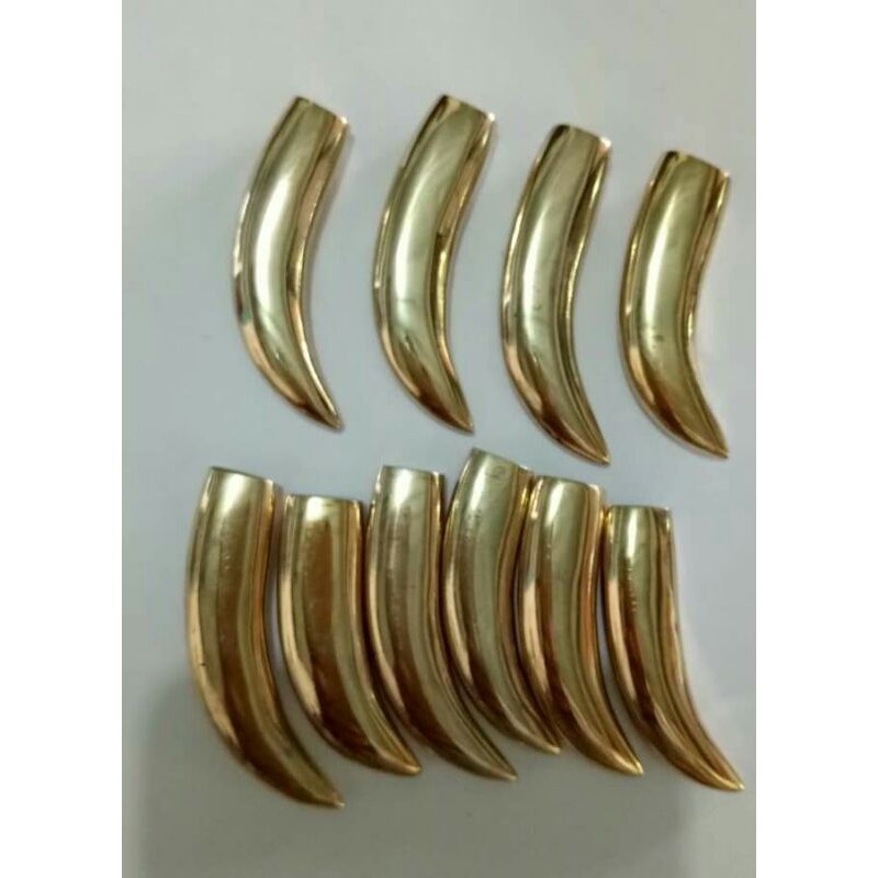 Besi kuning asli berbentuk taring