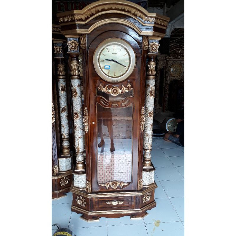 lemari jam kayu jati ukiran asli buatan jepara