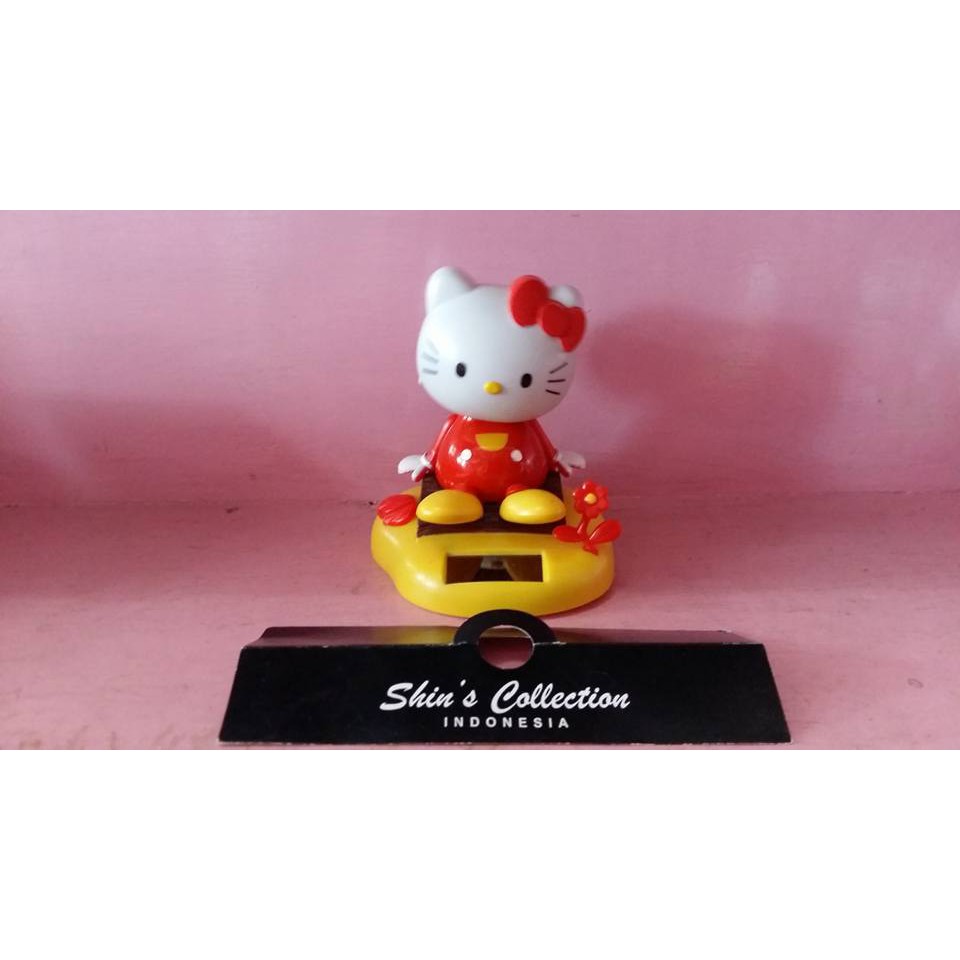 pajangan solar hello kitty bunga red