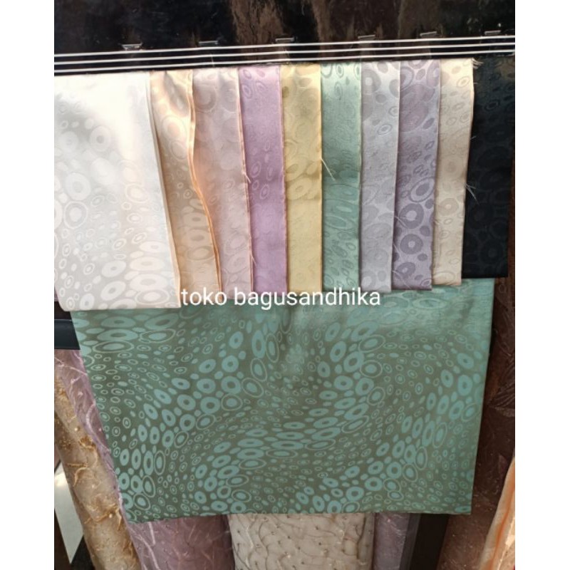 kain jaguard semi sutra embos glossy