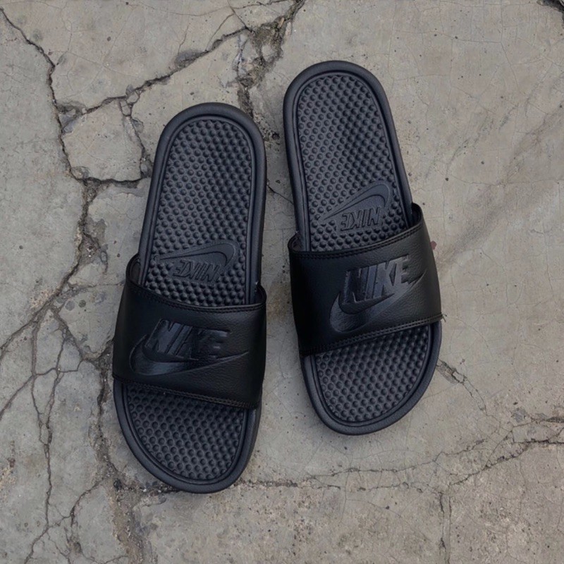 black and blue nike slides