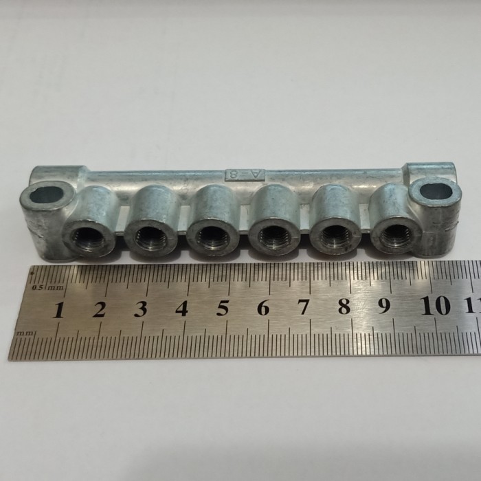 Nepel cabang / manifold oli 6 lubang