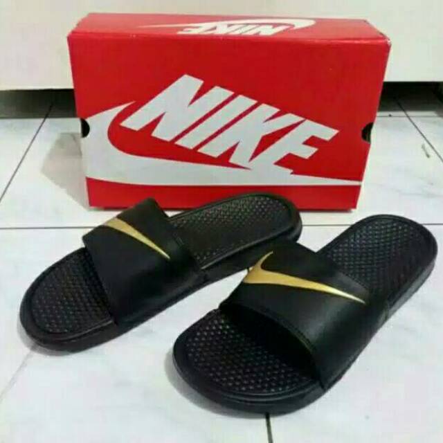 red nike slides gold swoosh