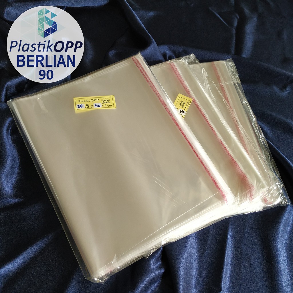 

RN Plastik OPP 28,5 X 40 CM 20 MIC 100LBR Lem Atau Seal / Plastik bening kemasan bungkus baju gamis