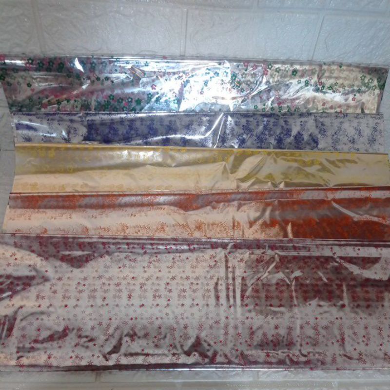 

Plastik Kaca Kado Bening Motif / Plastik Hantaran (Isi 50 lembar)