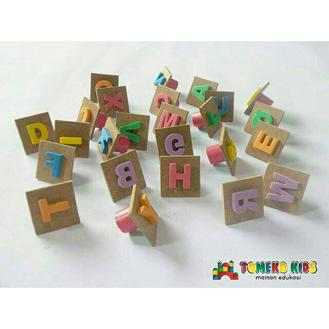 

Mainan edukasi stempel huruf tomeko
